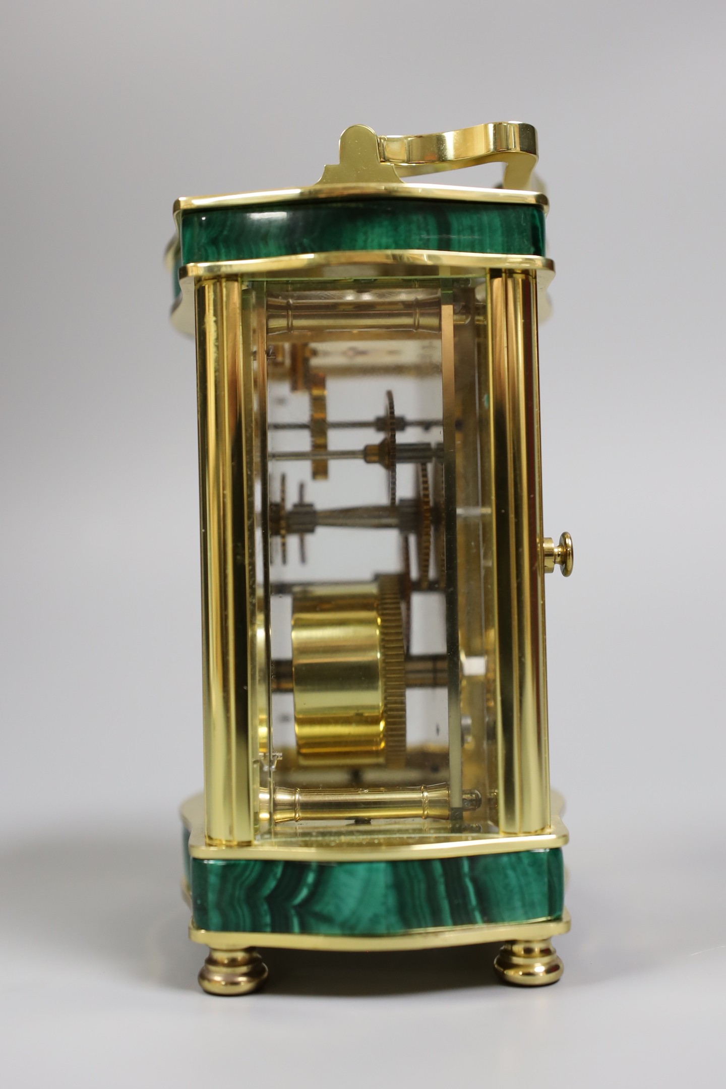 An Asprey carriage timepiece with key, 12 cms high, and an Asprey presentation box